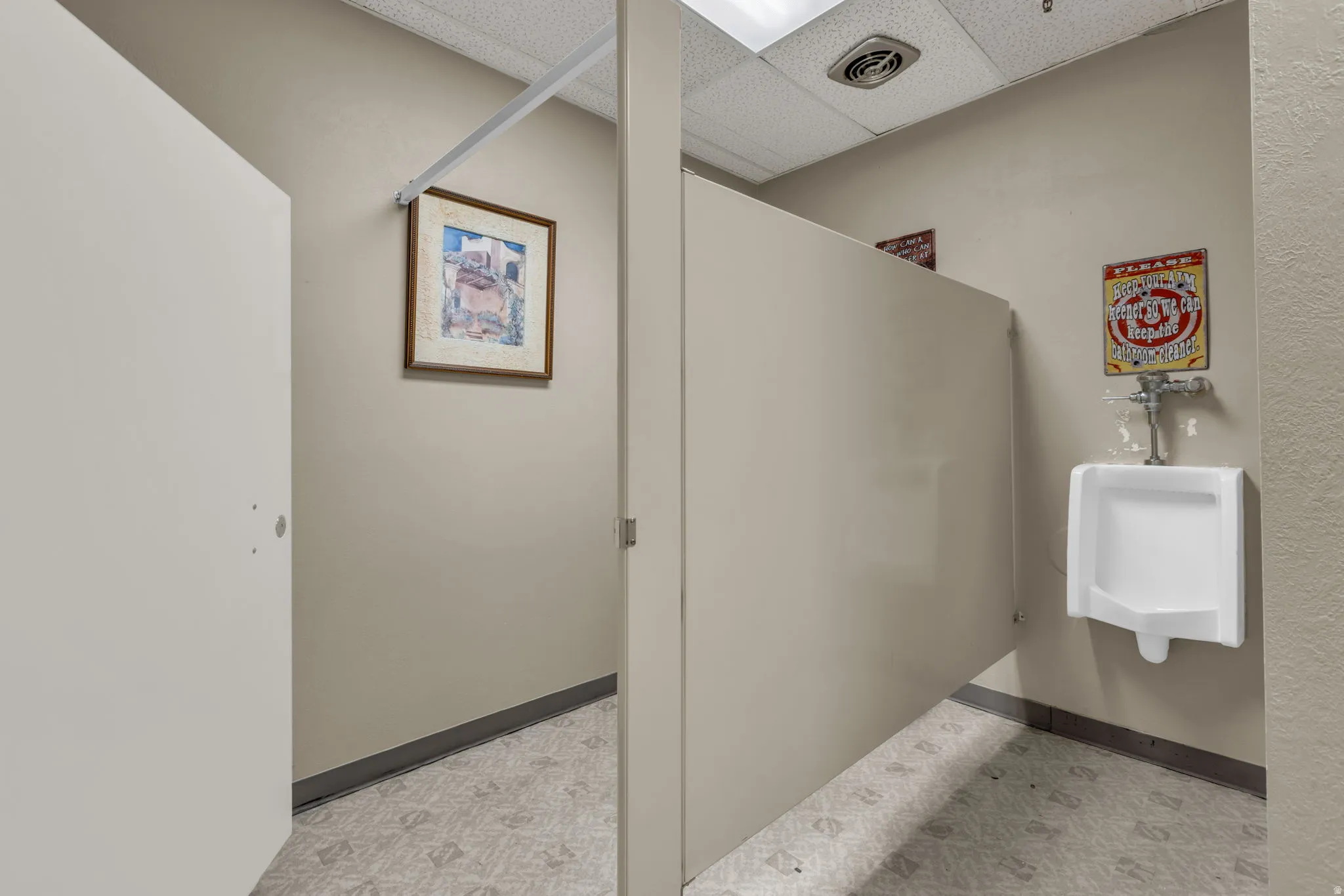 Bathroom featuring a drop ceiling