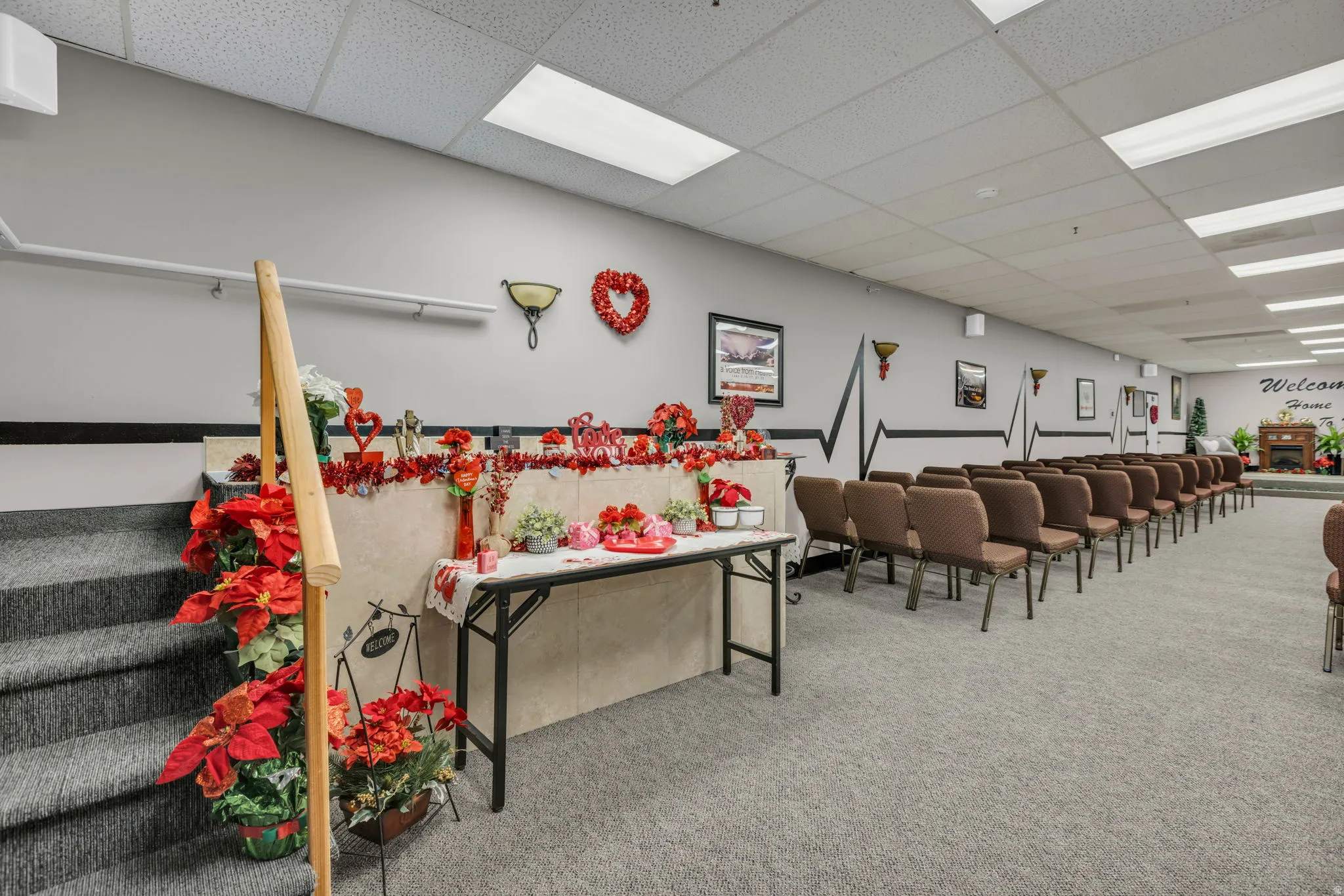 Misc room featuring a paneled ceiling and stairway