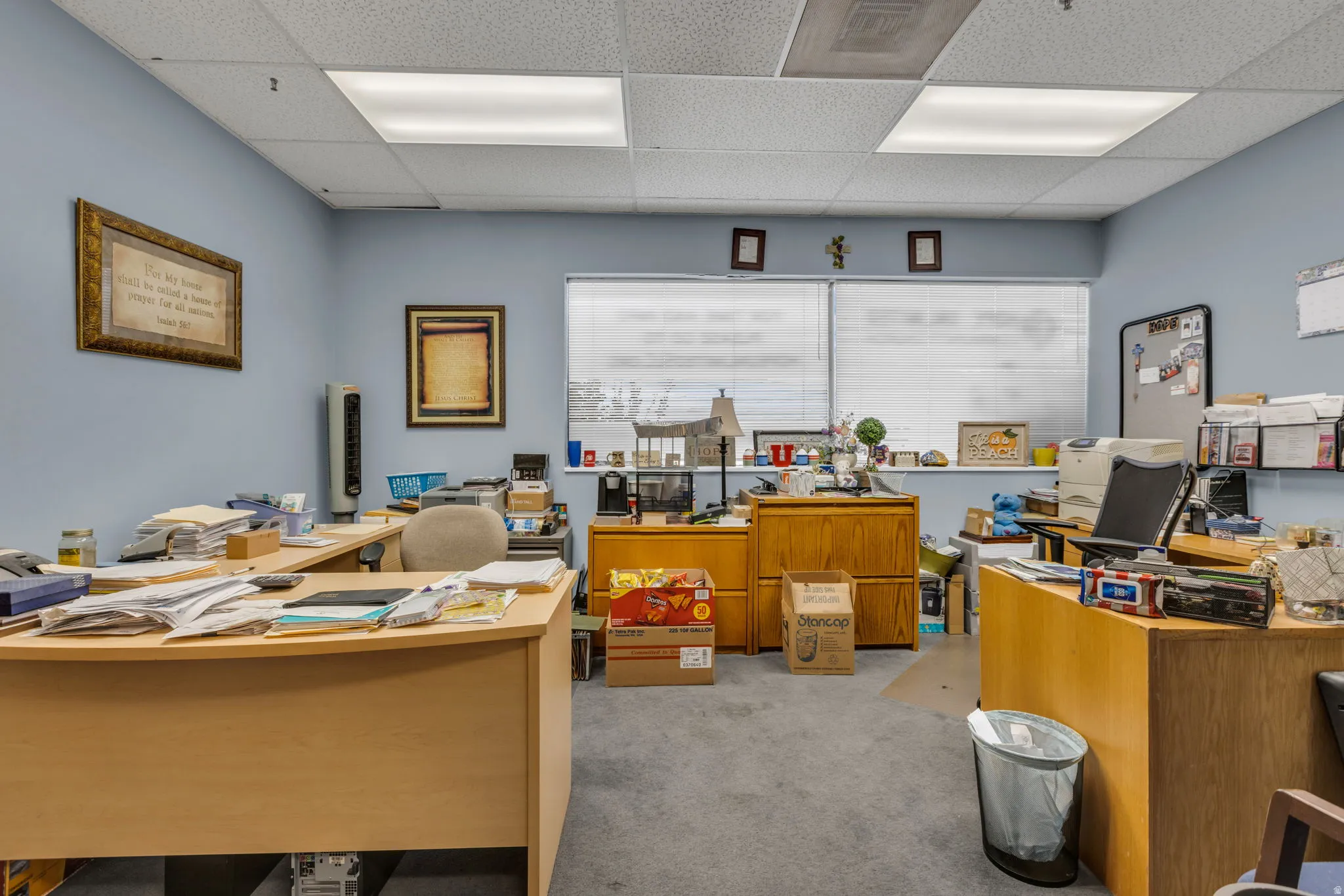 Office with a paneled ceiling