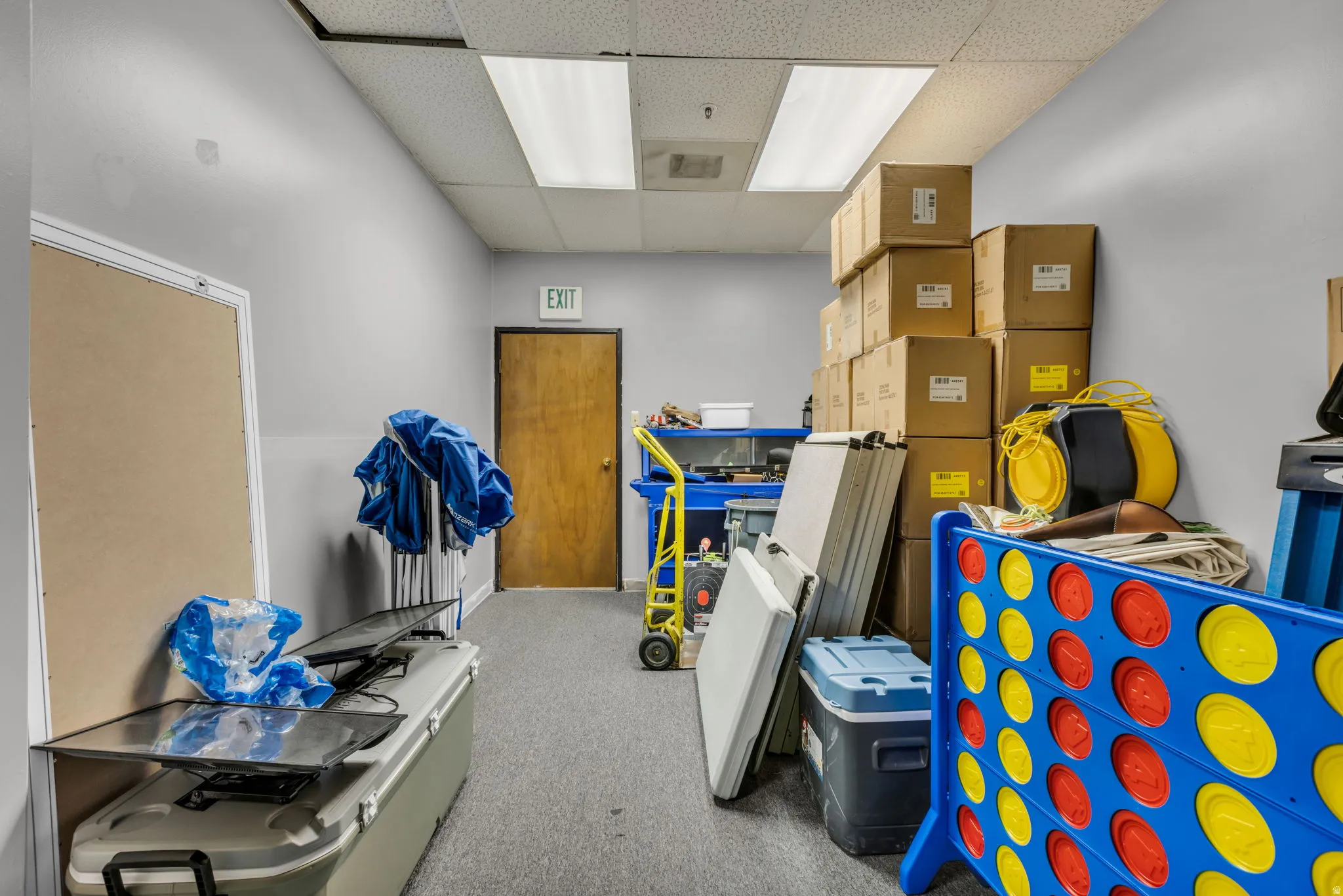 Misc room featuring a drop ceiling and heating unit