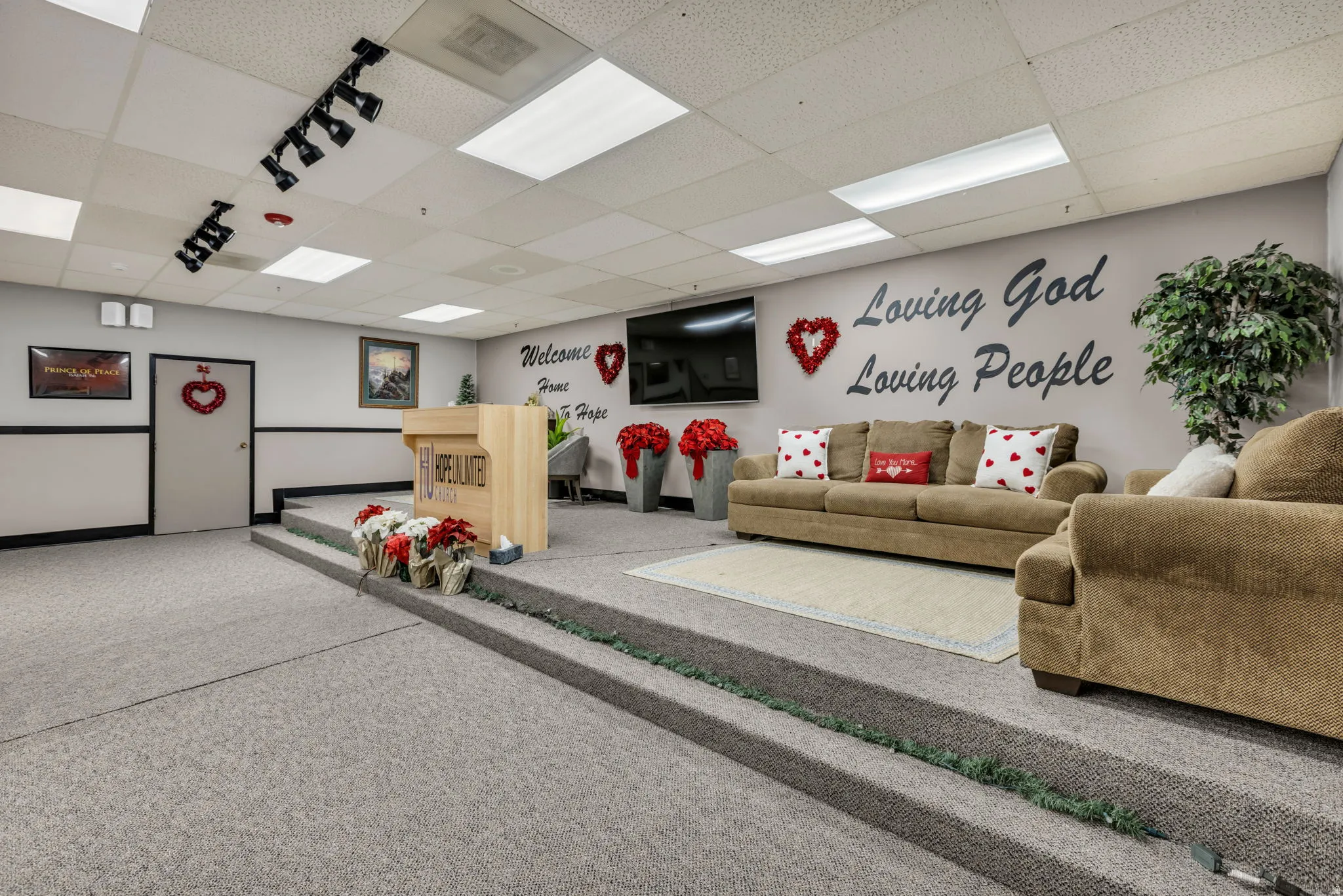 Living room with a paneled ceiling and carpet floors