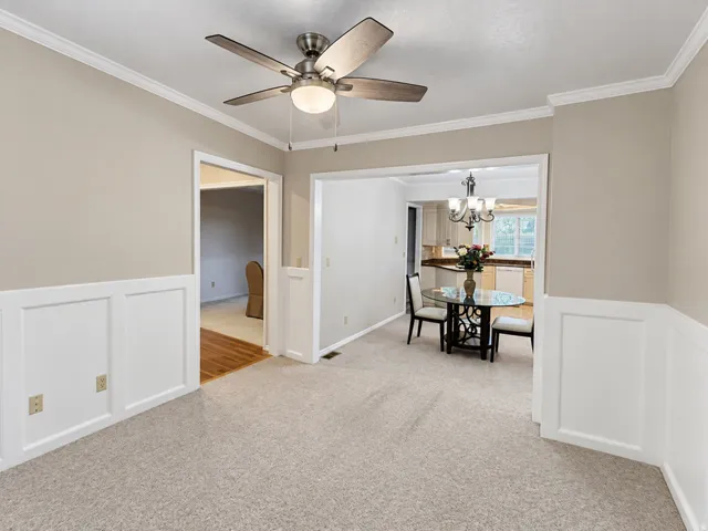 Neutral wall finishes, crown molding, and wainscoting