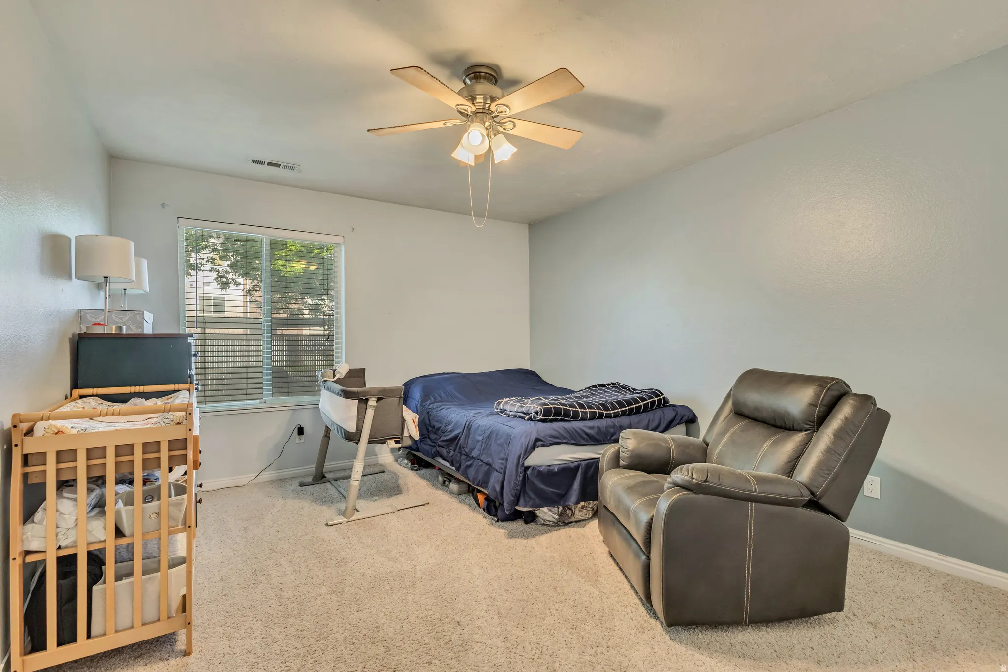 Bedroom featuring carpet flooring and a ceiling fan