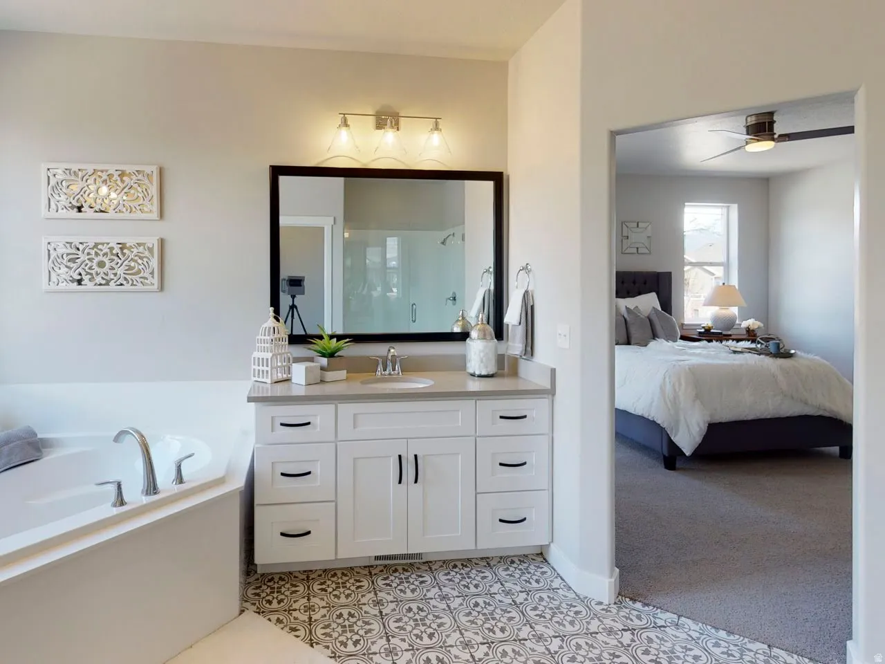 Bathroom featuring a bath, vanity, ensuite bathroom, a shower stall, and light carpet