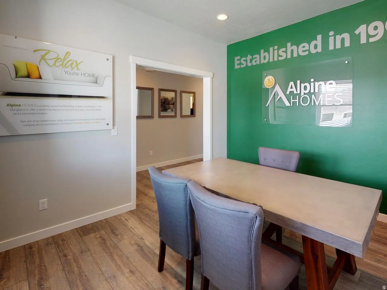 Office space featuring wood finished floors and recessed lighting