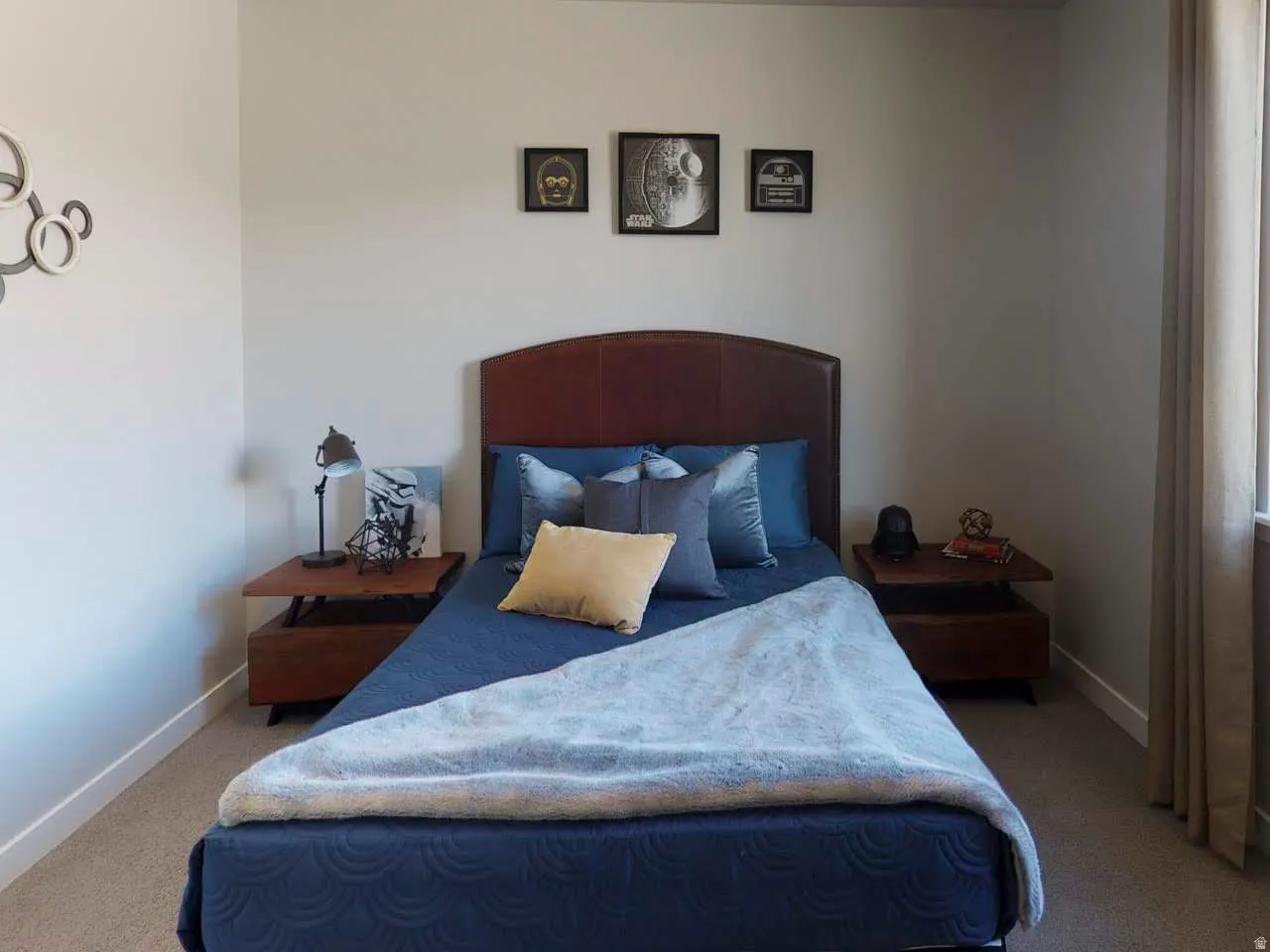 Bedroom with light carpet and baseboards