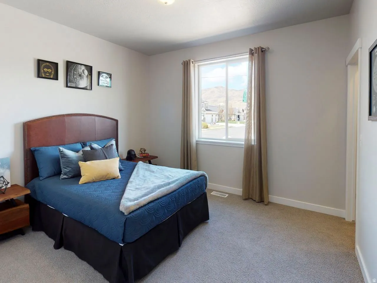 Bedroom featuring light colored carpet and a mountain view