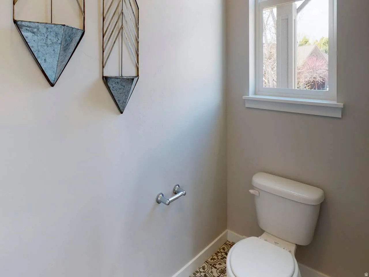 Bathroom with toilet and baseboards