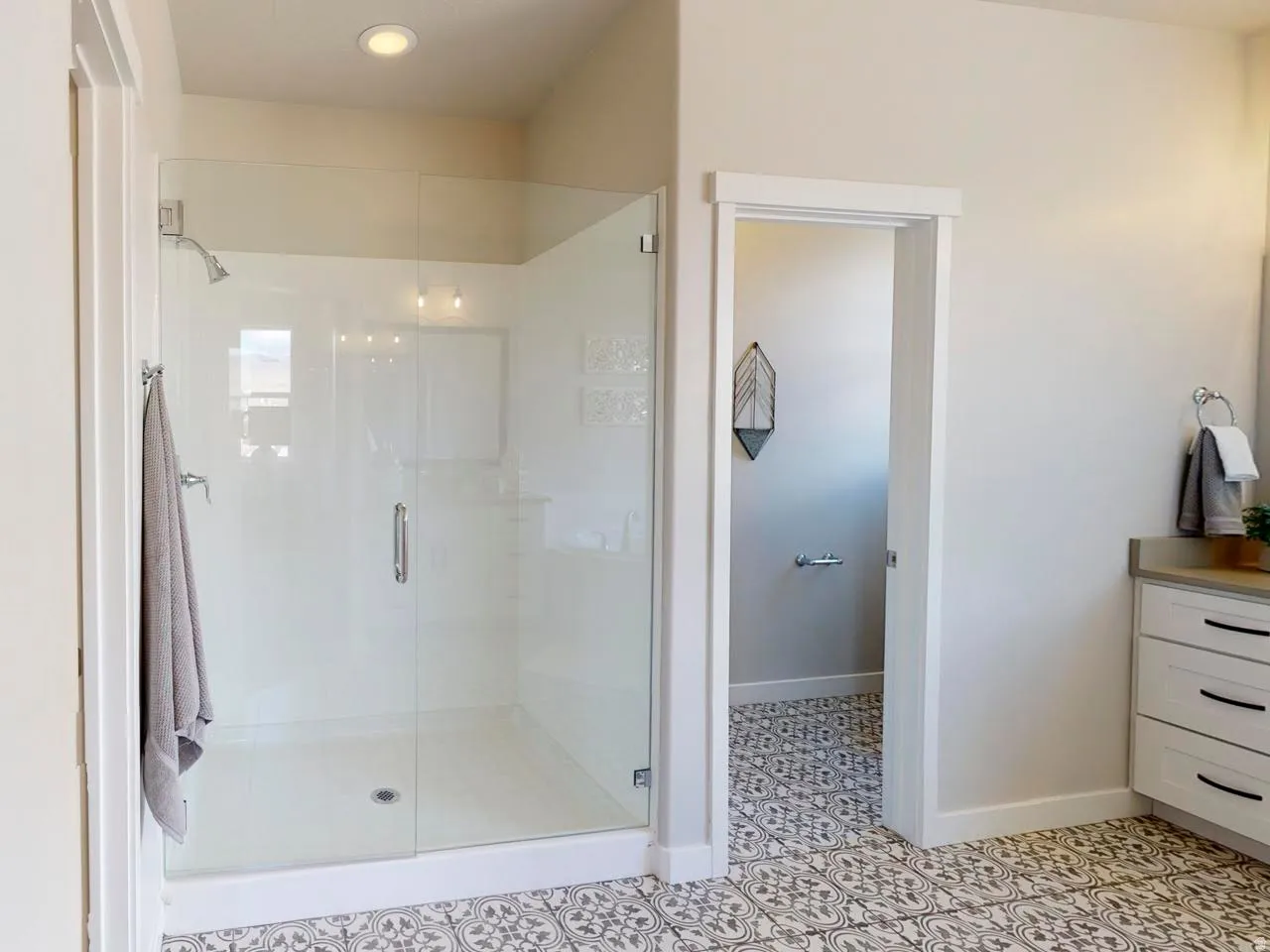 Full bath featuring a stall shower, vanity, and recessed lighting