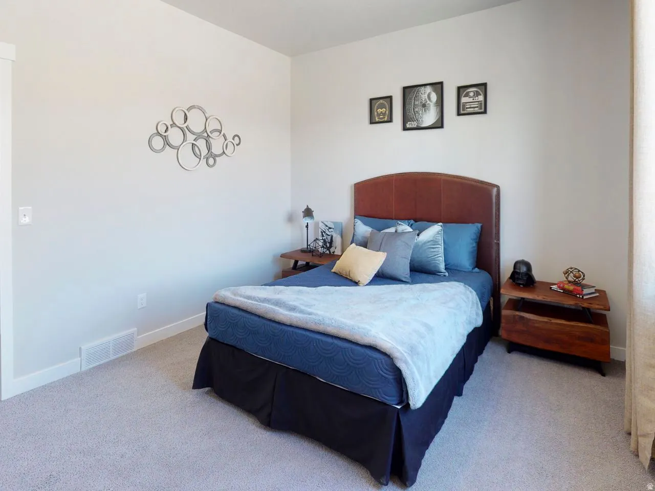 Bedroom with light carpet and baseboards