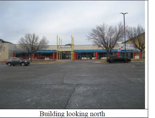 View of commercial location with uncovered parking