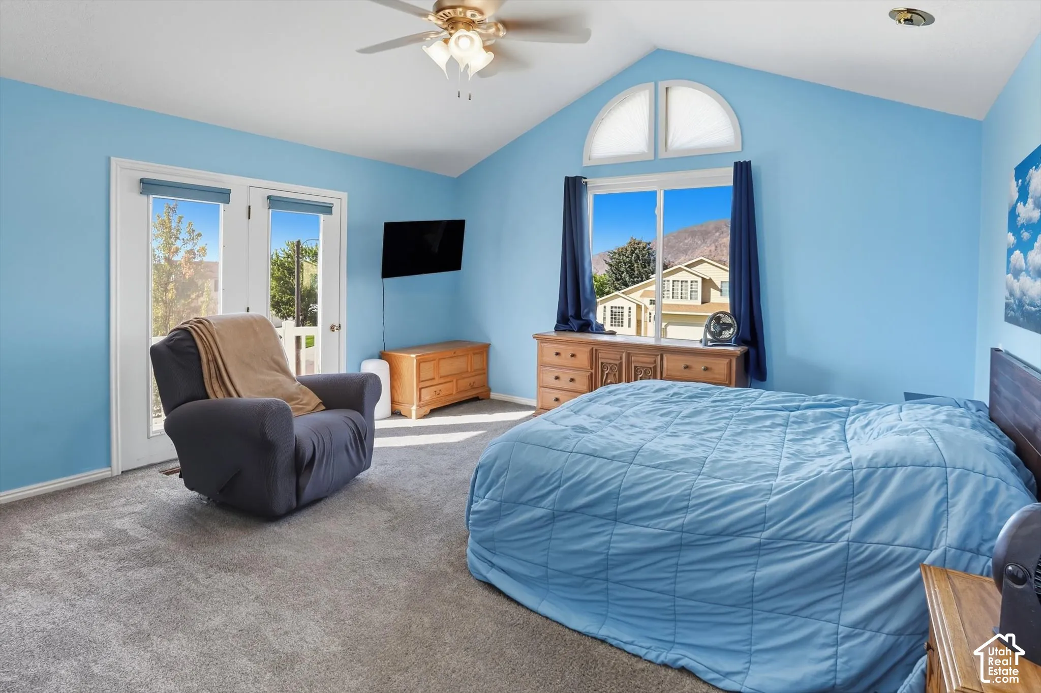 Carpeted bedroom with access to exterior and a ceiling fan