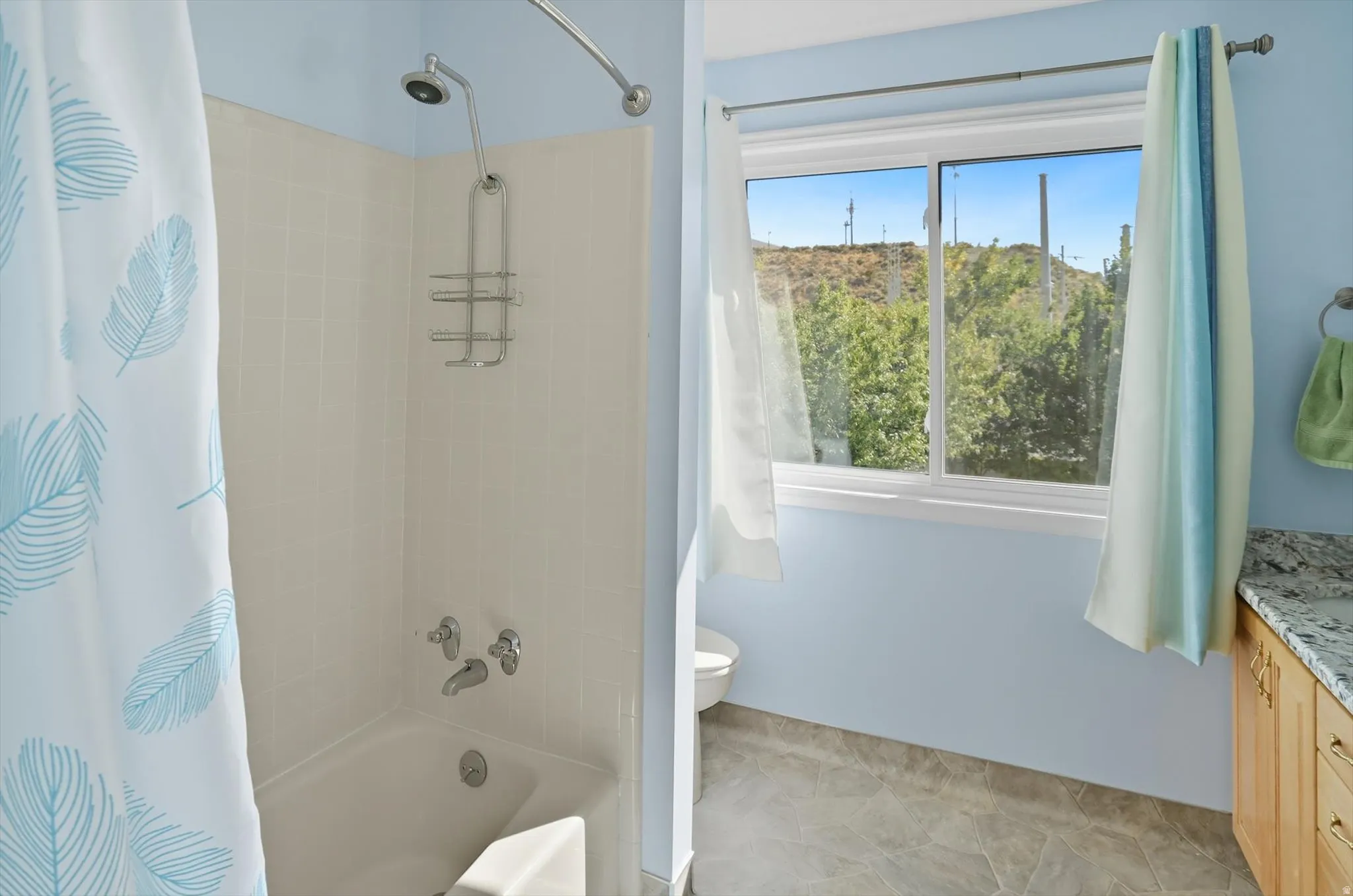 Full bathroom featuring vanity and shower / bath combination with curtain