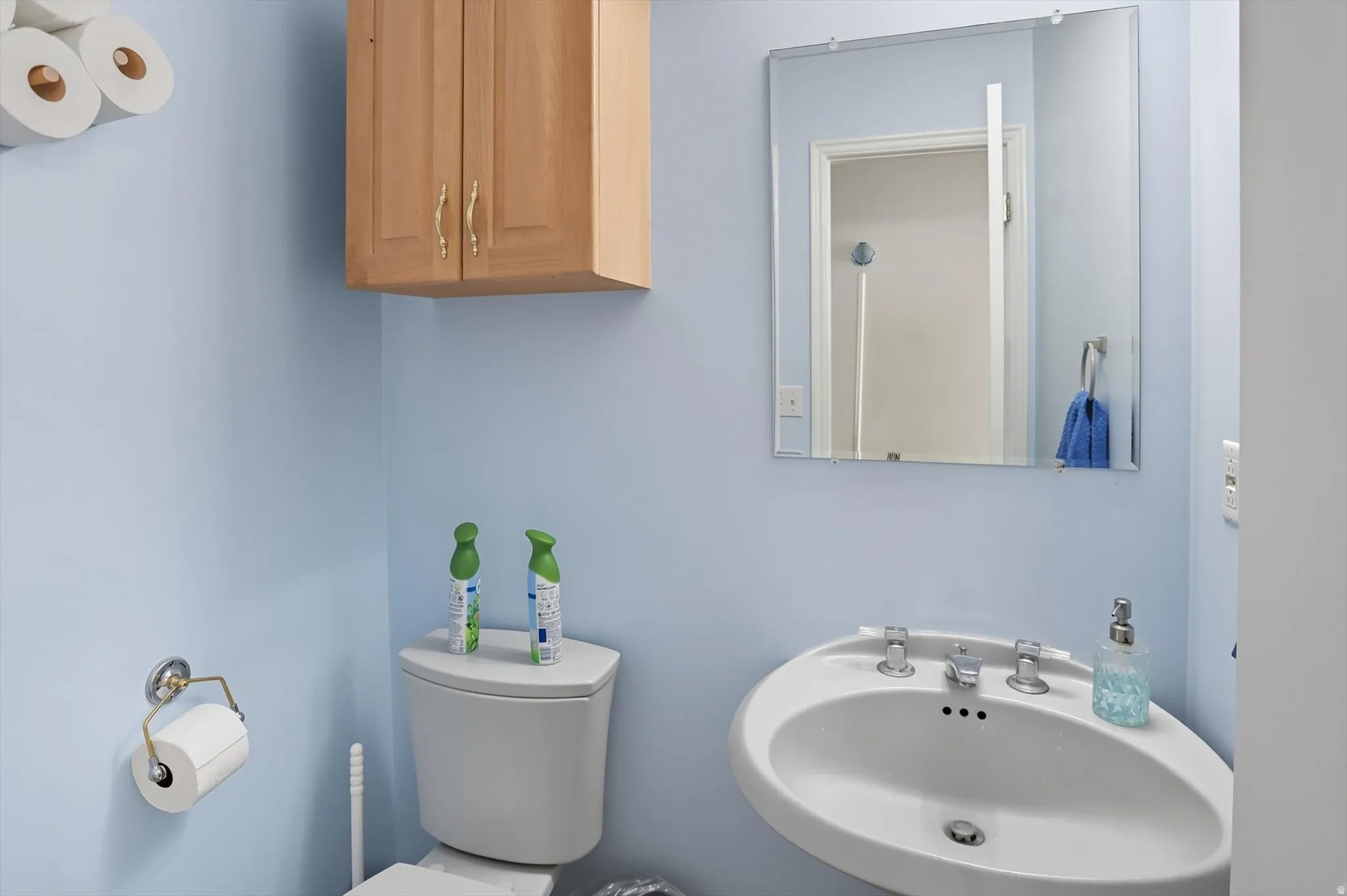 Half bathroom featuring a sink and toilet