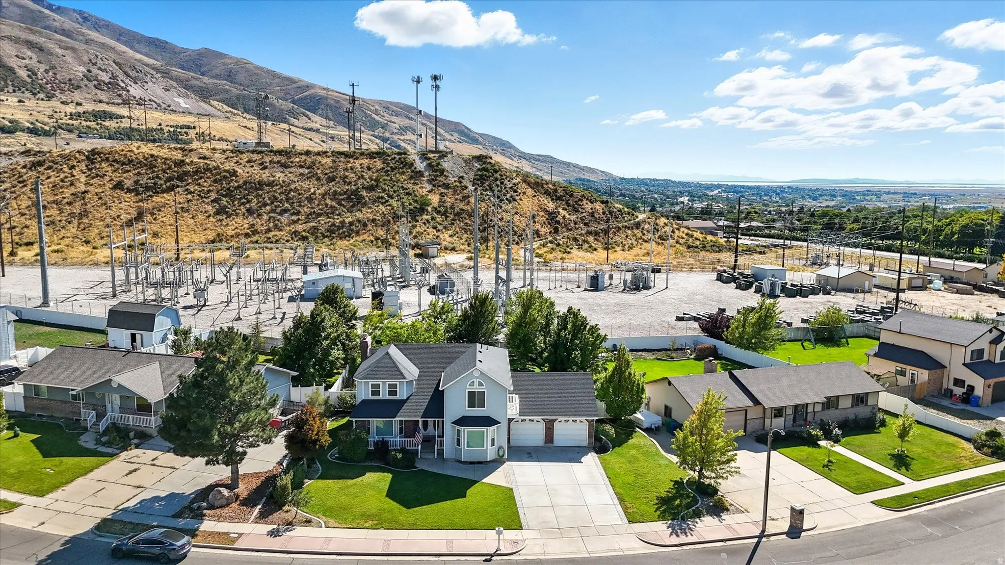 Aerial perspective of suburban area featuring a mountain backdrop