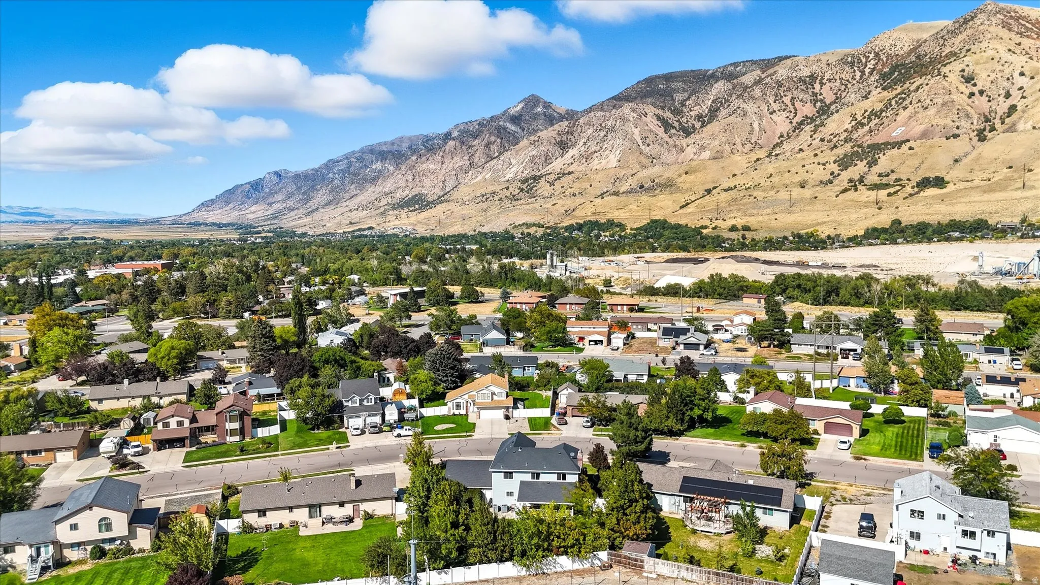 Aerial view of residential area featuring a mountainous background