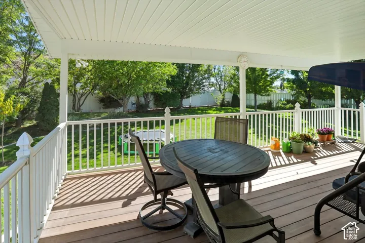 Wooden terrace featuring outdoor dining space