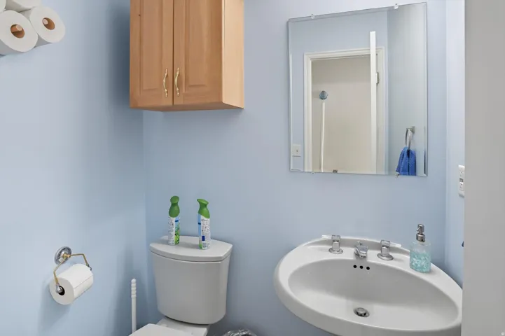 Half bathroom featuring a sink and toilet