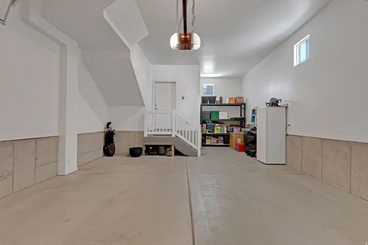 Garage featuring a garage door opener