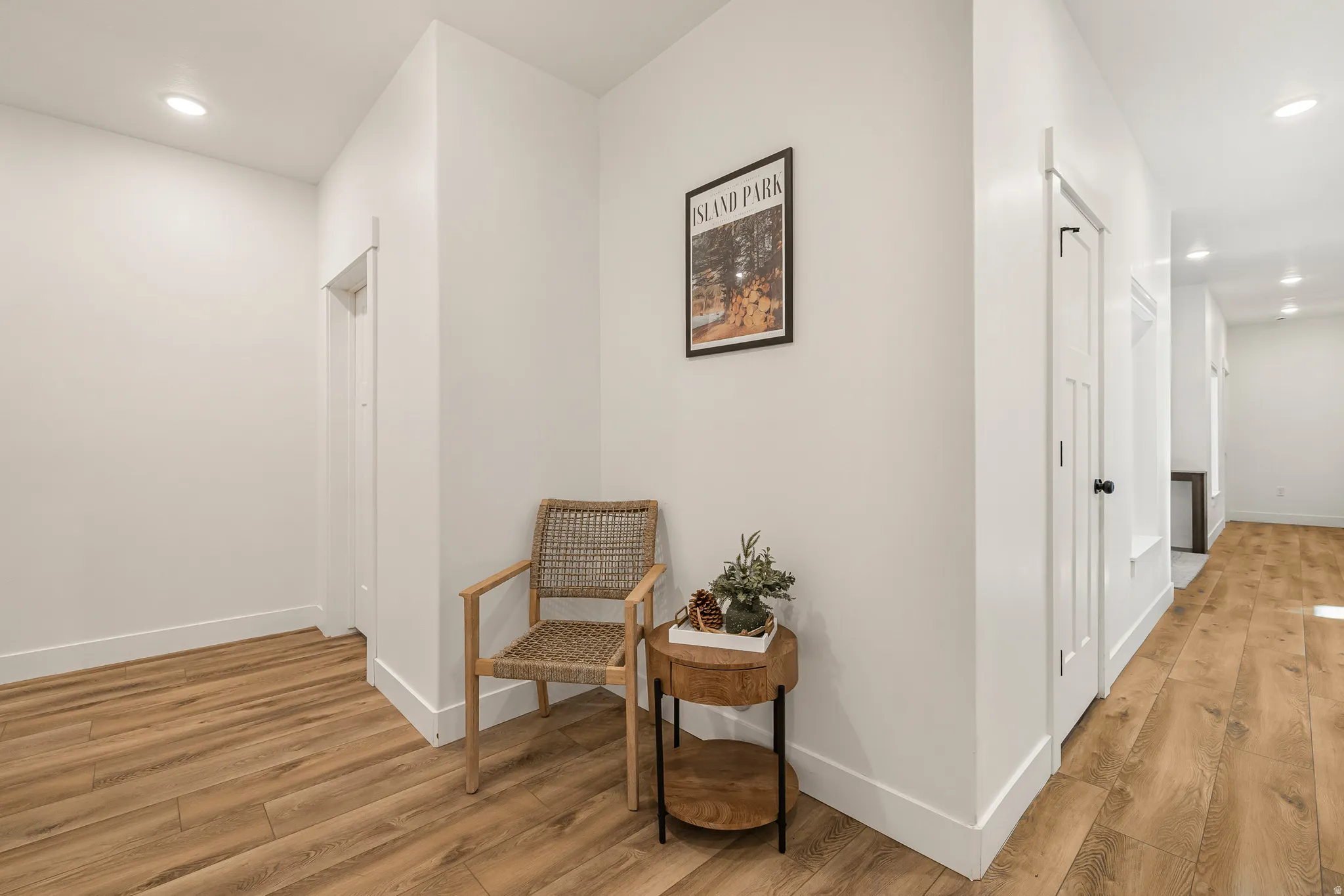 Hall featuring recessed lighting and light wood finished floors