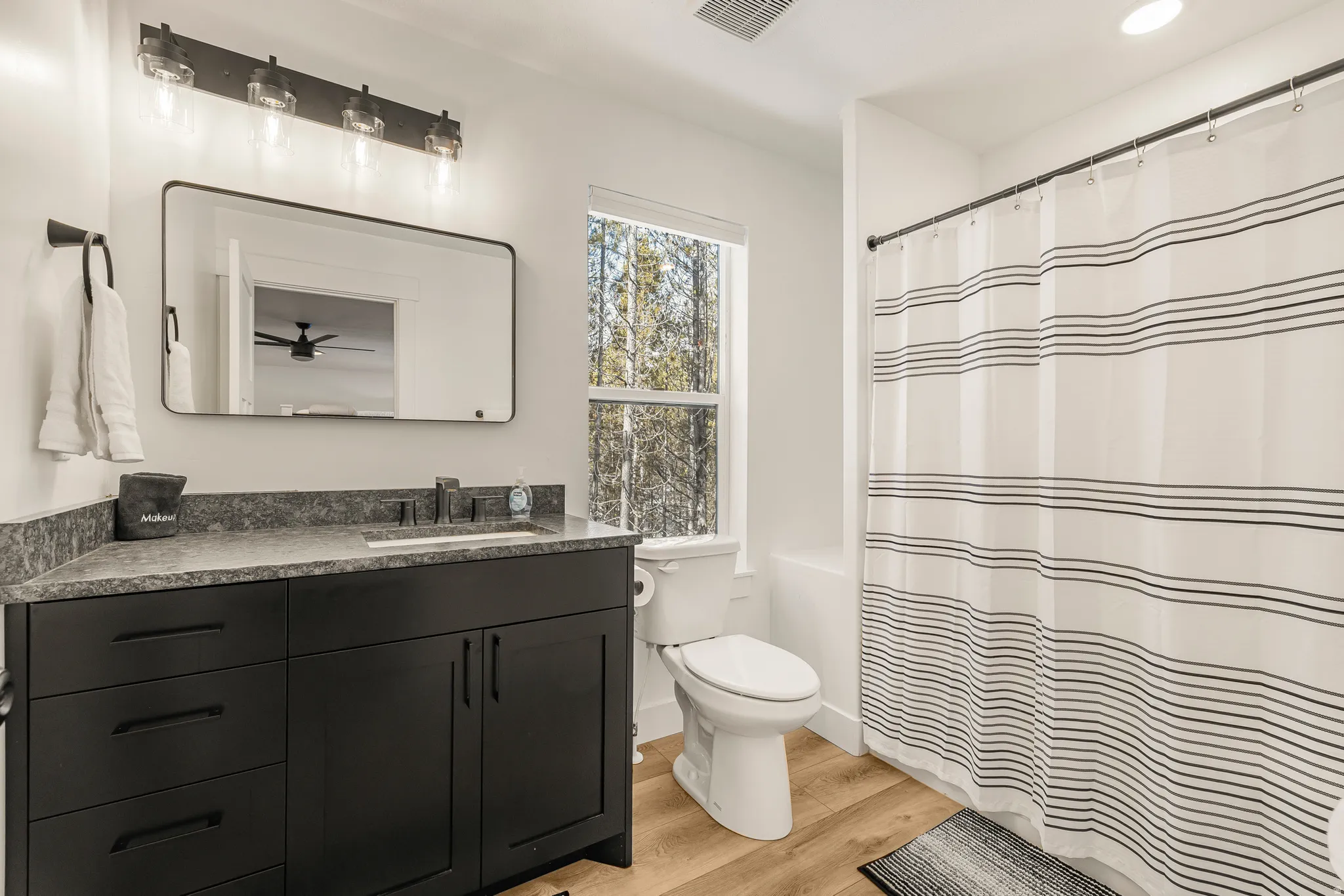 Bathroom with vanity and light wood-style flooring