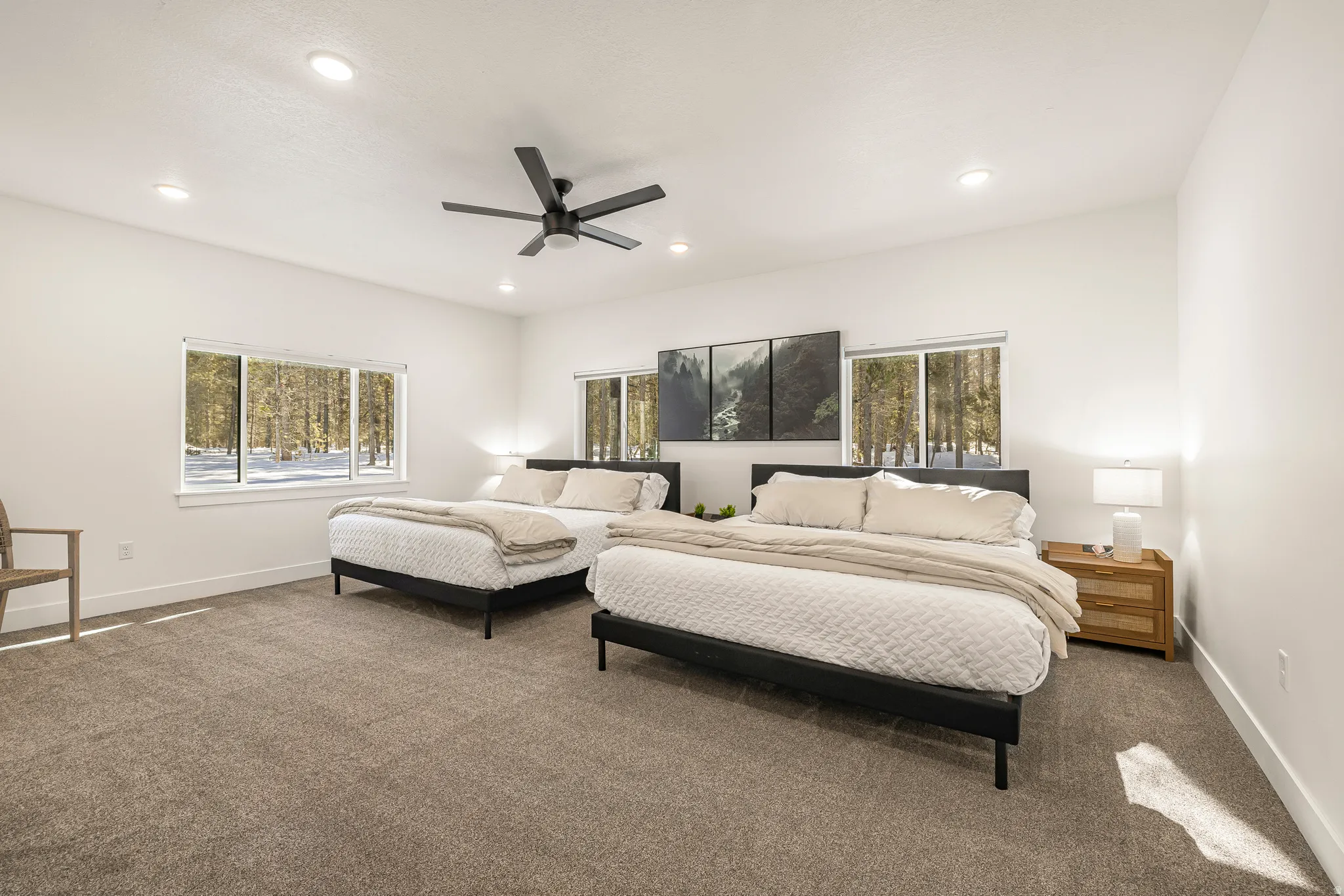Carpeted bedroom with ceiling fan and recessed lighting