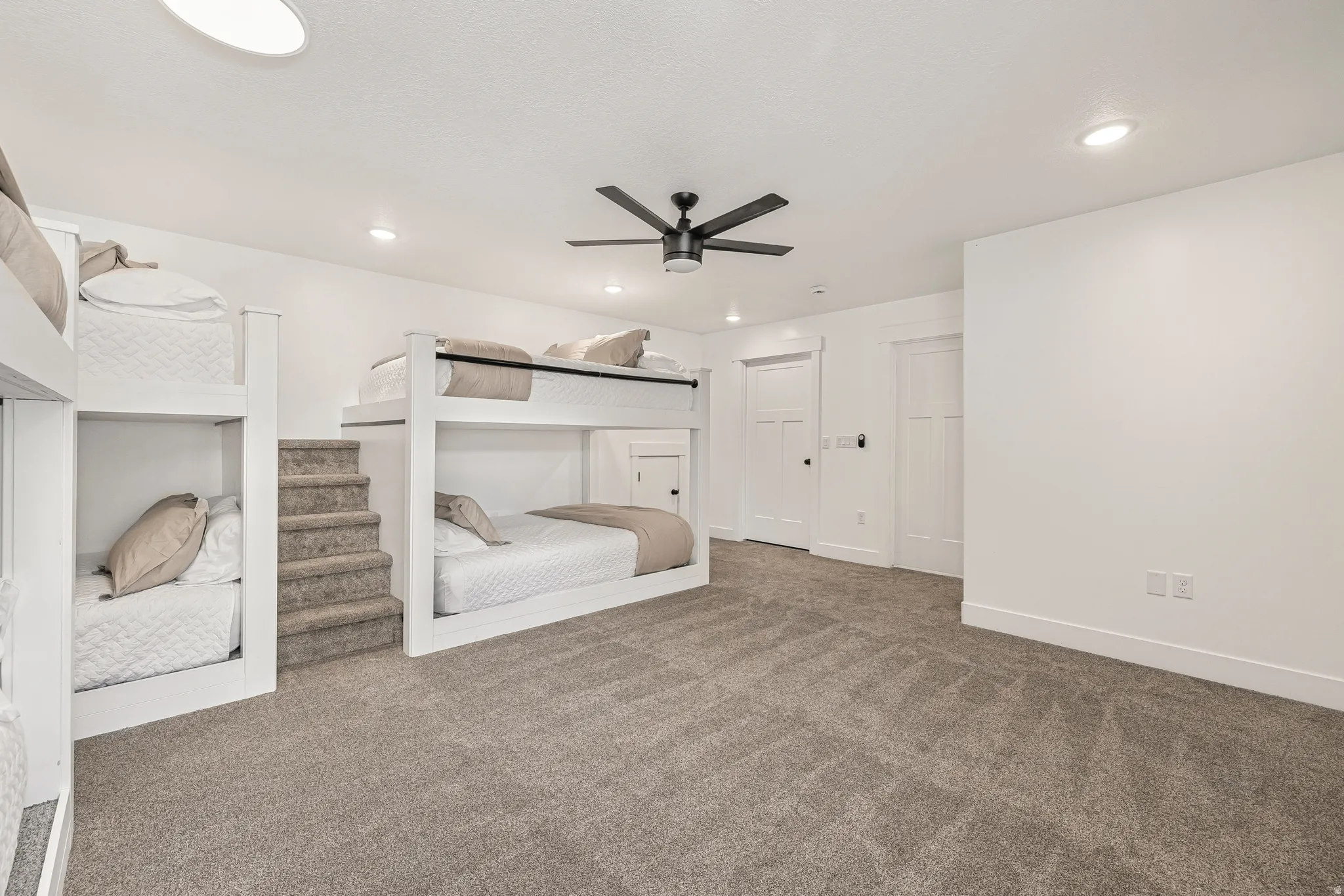 Bedroom featuring carpet flooring, a ceiling fan, and recessed lighting