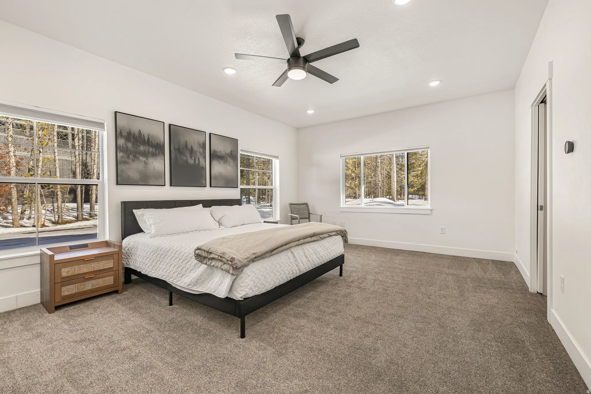 Bedroom with dark carpet, a ceiling fan, and recessed lighting