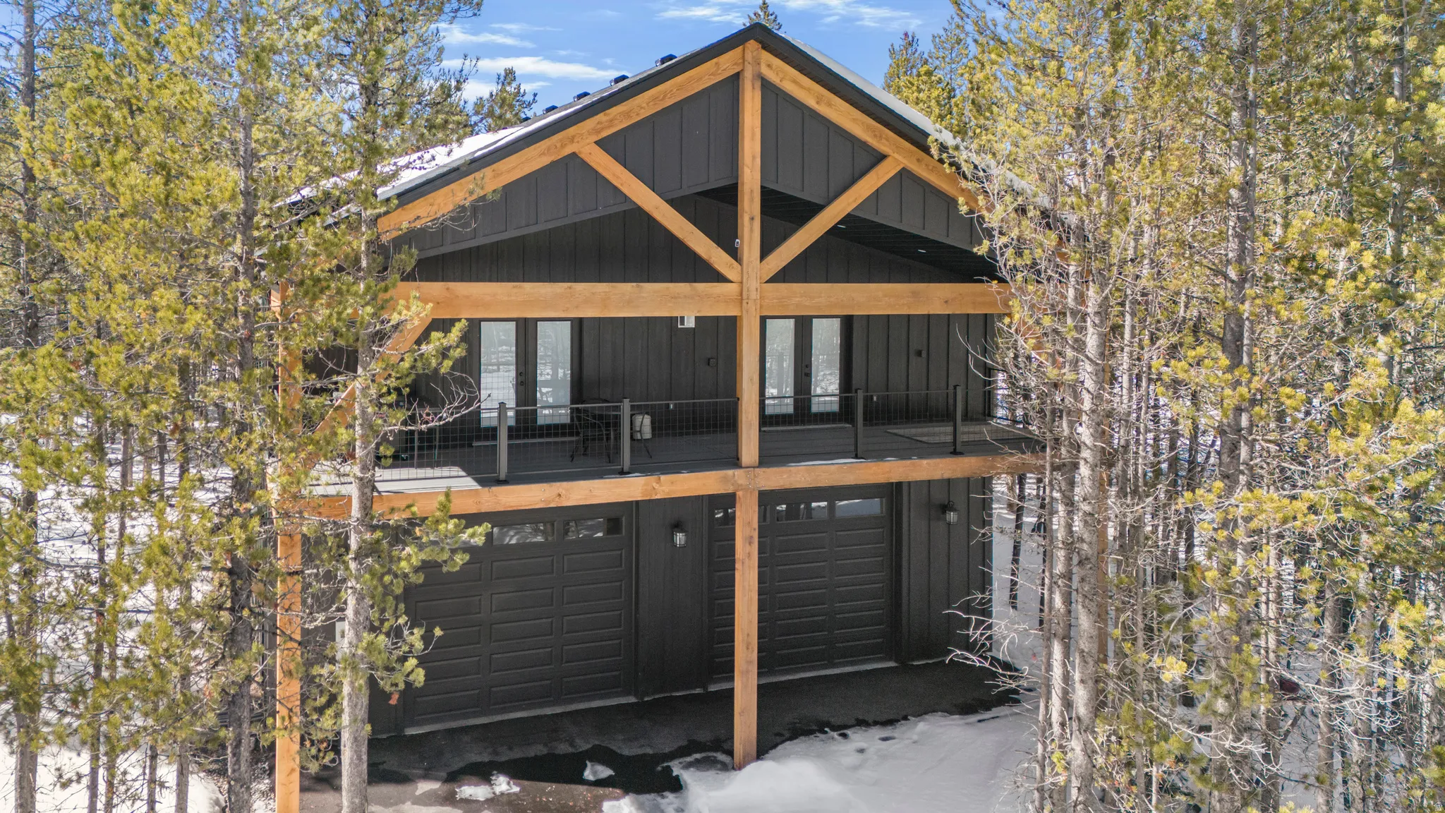 Back of property featuring a garage