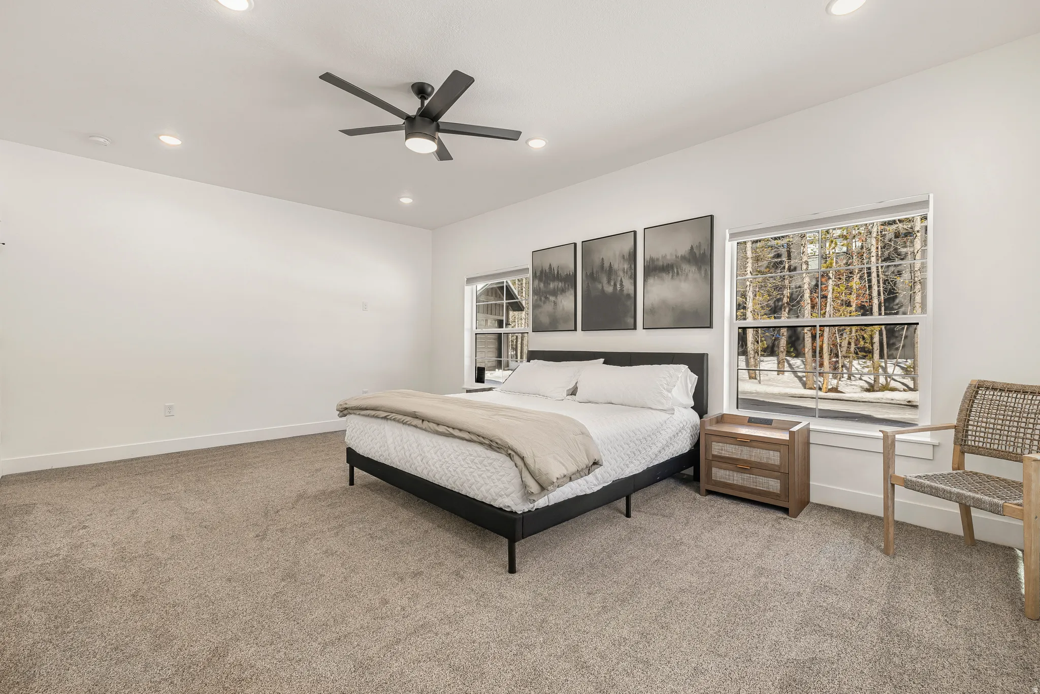 Bedroom with light colored carpet, recessed lighting, and a ceiling fan