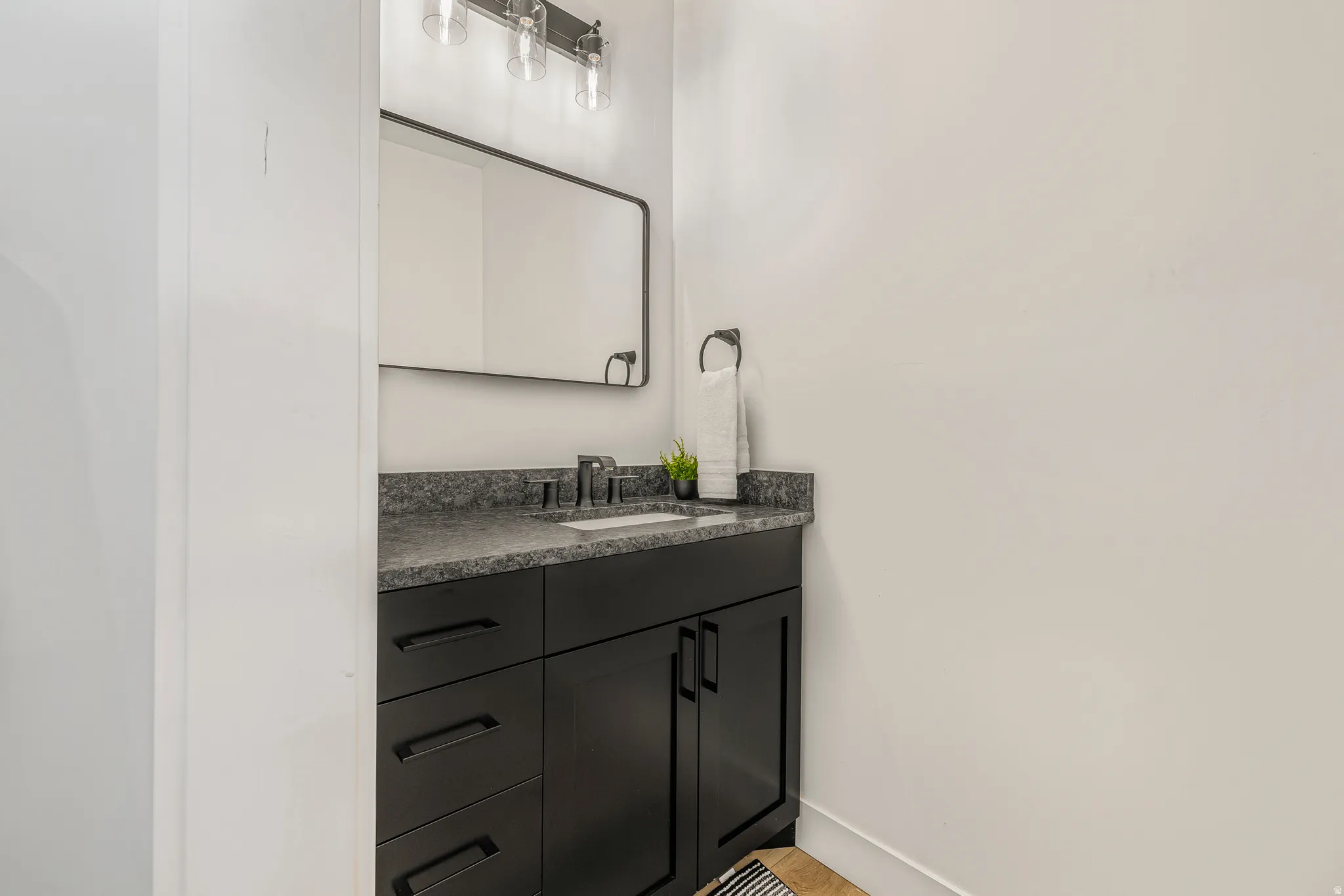 Bathroom with vanity and baseboards