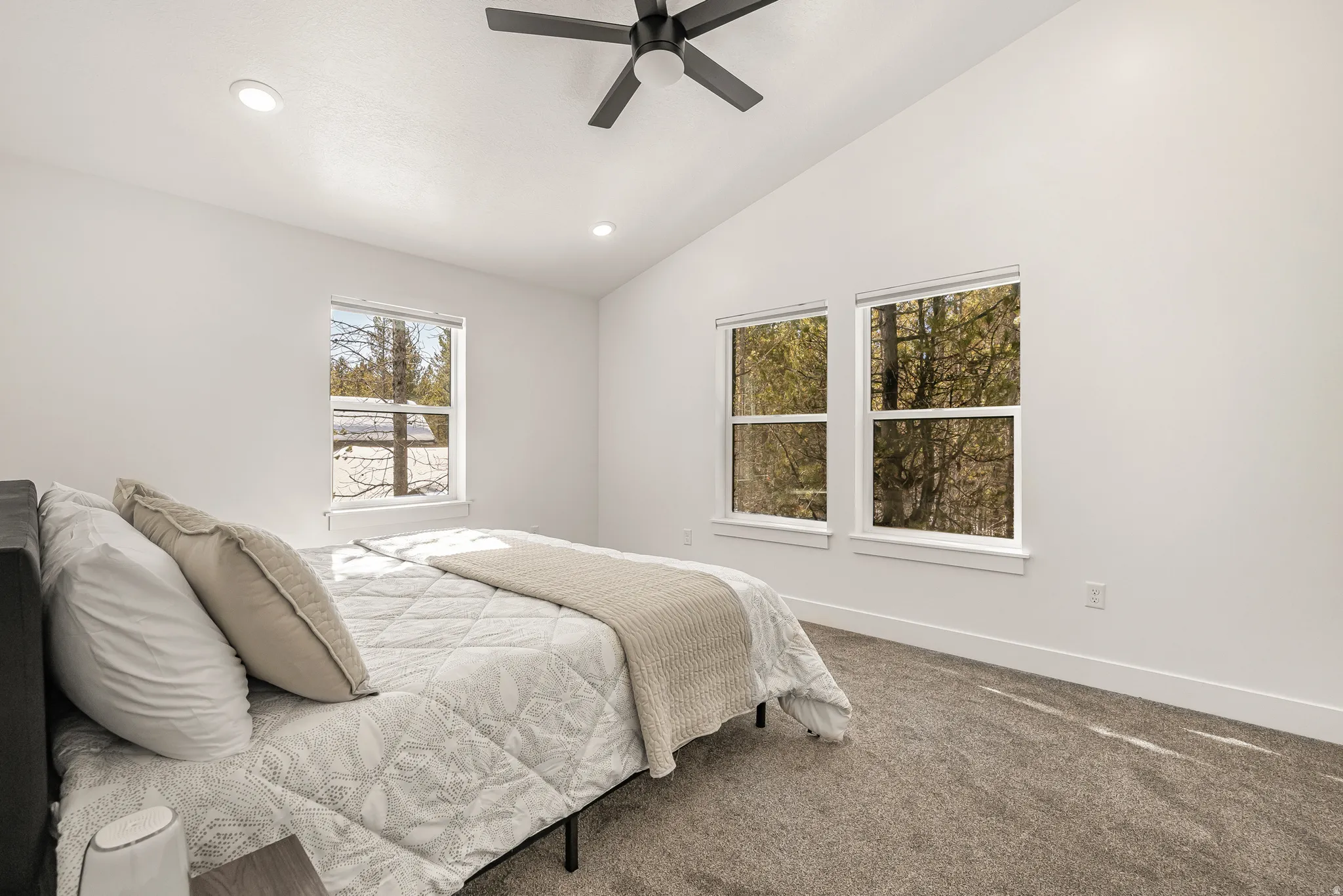 Bedroom with vaulted ceiling, carpet, recessed lighting, and a ceiling fan