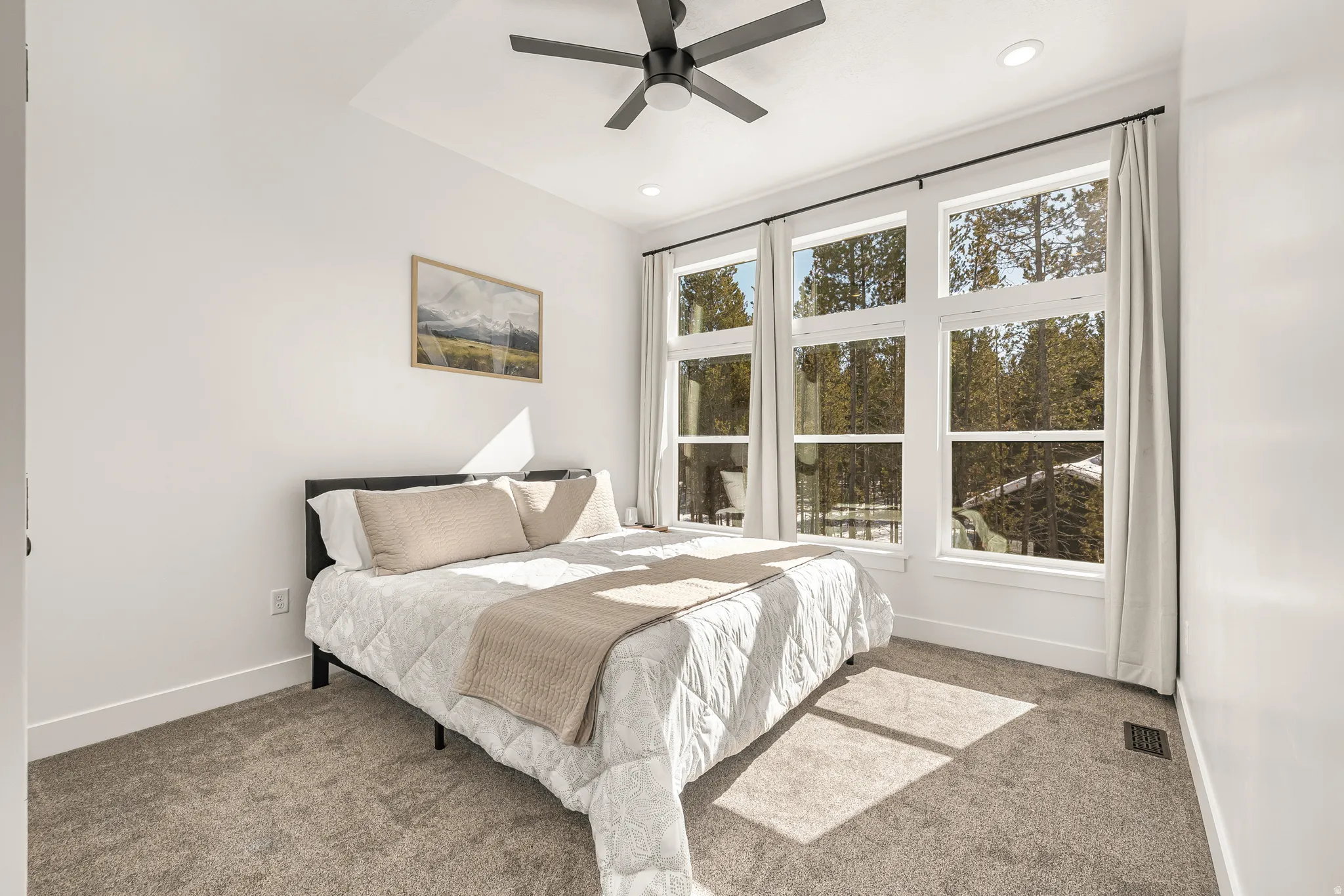 Bedroom featuring a ceiling fan, carpet floors, and recessed lighting