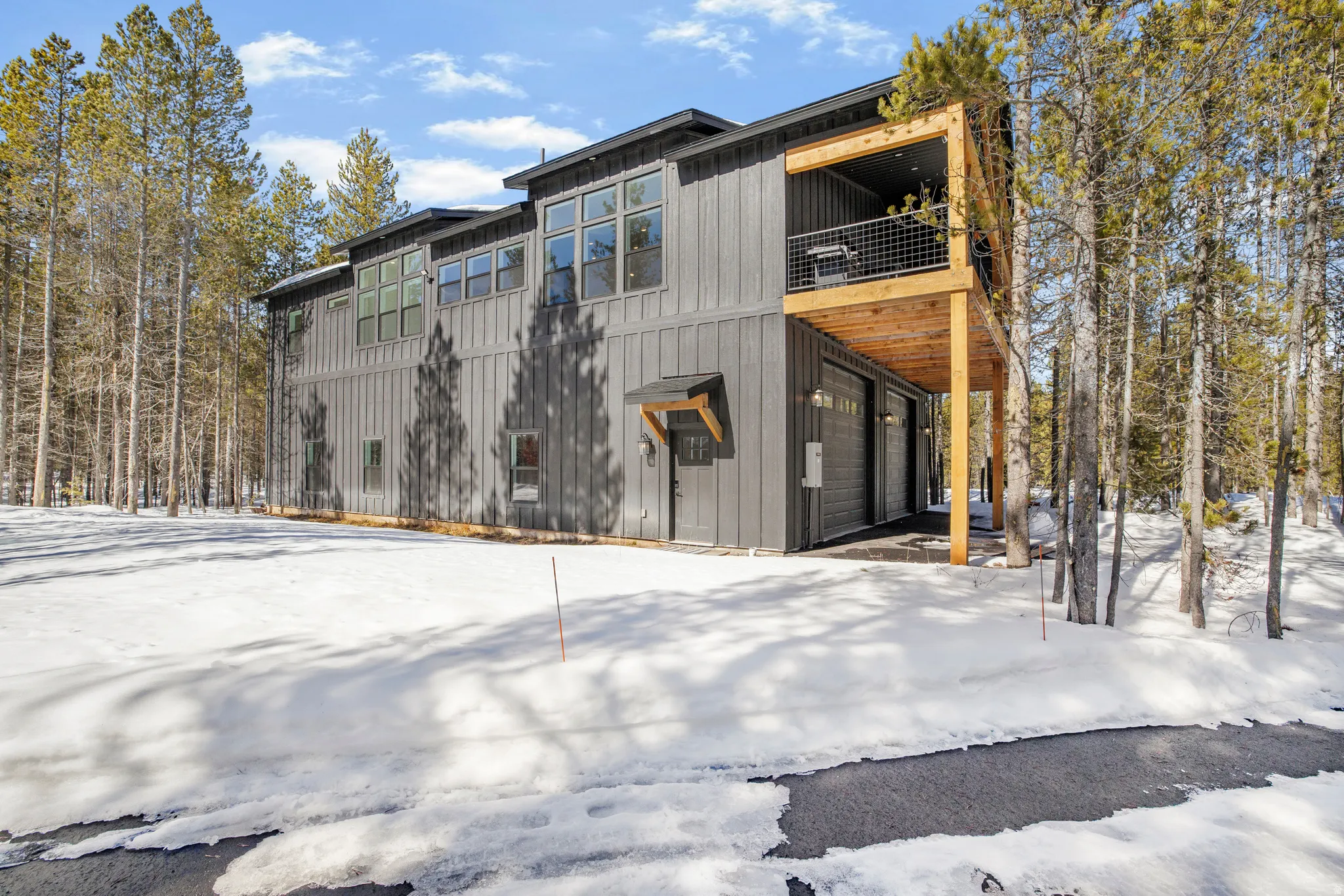 Exterior space with a balcony and an attached garage
