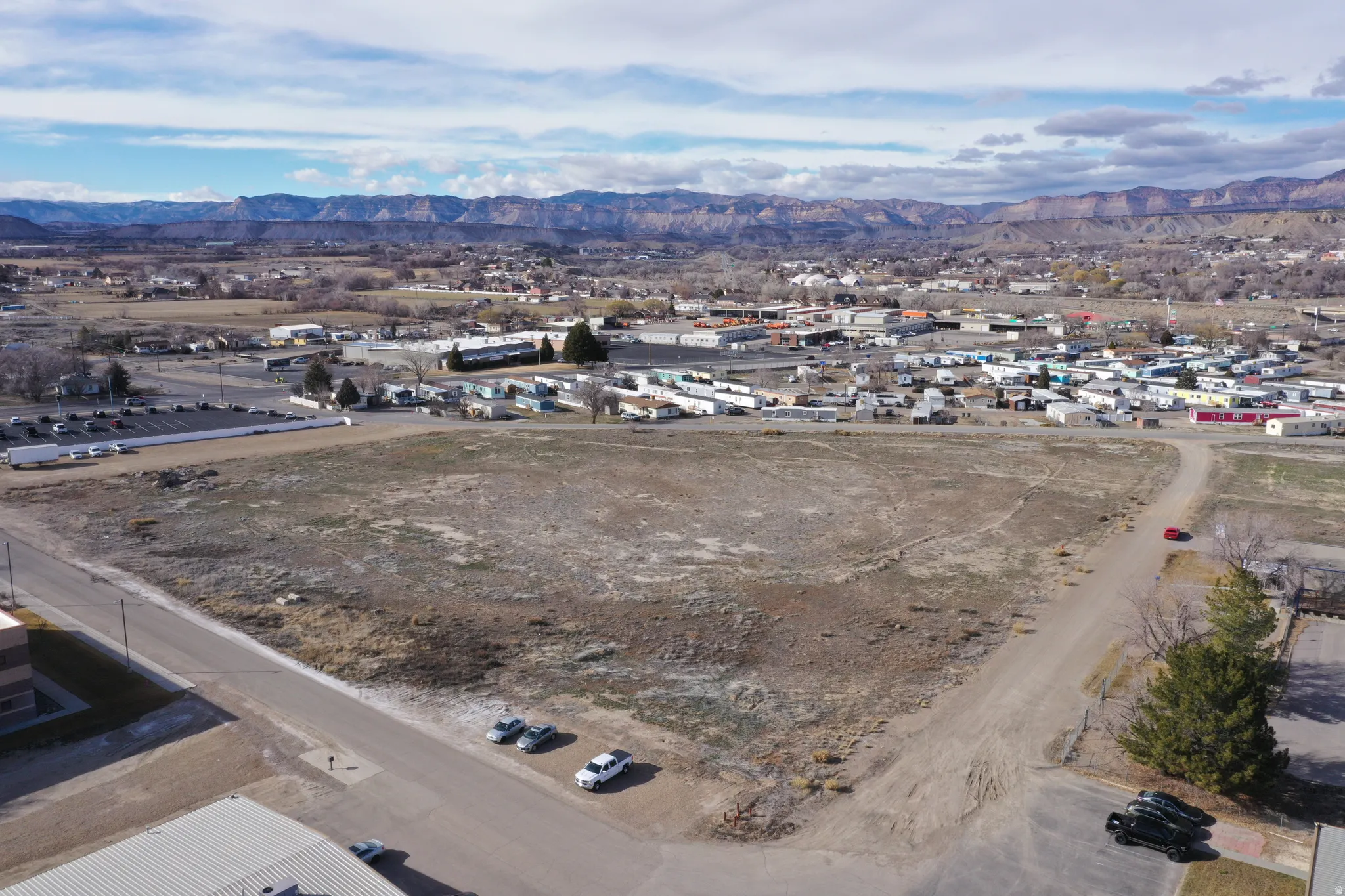 Aerial overview of property's location featuring a mountainous background