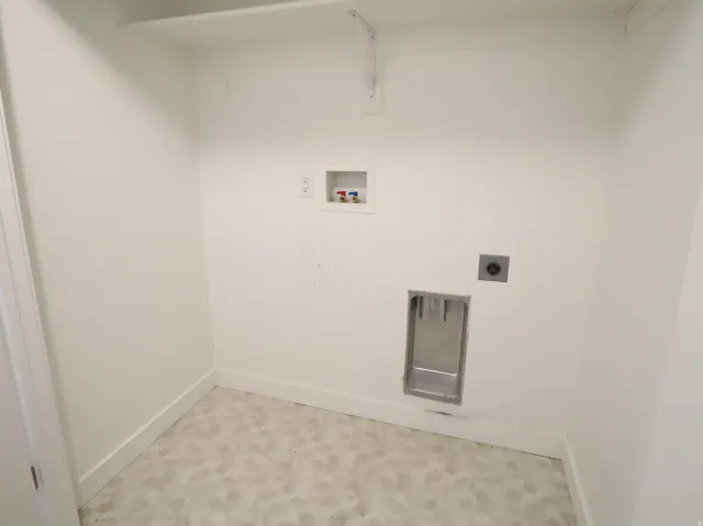 Laundry area with washer hookup and electric dryer hookup