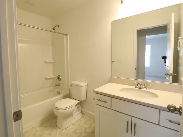 Bathroom with vanity and shower / tub combination