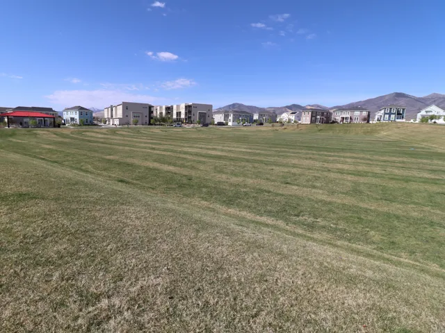 View of grassy yard with a residential view