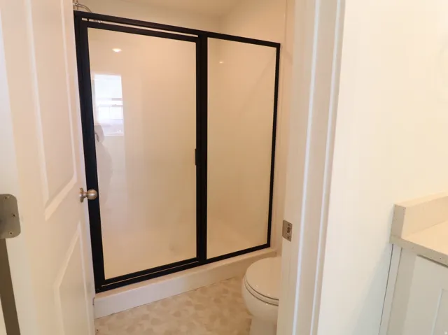 Bathroom with a shower stall and vanity