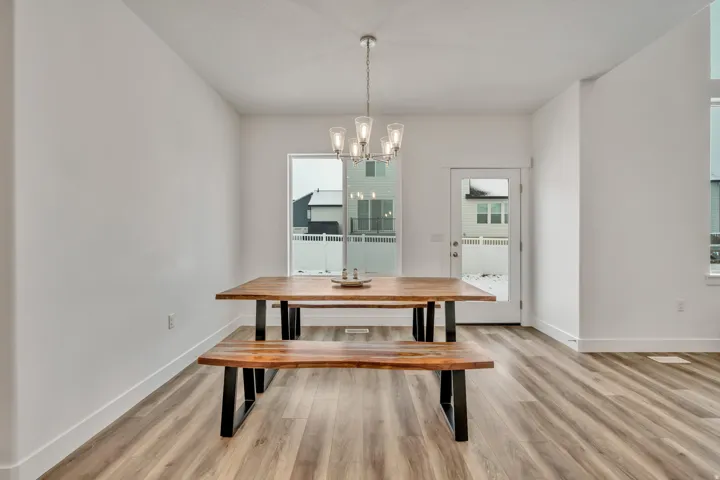 Dining space with a chandelier and light wood finished floors