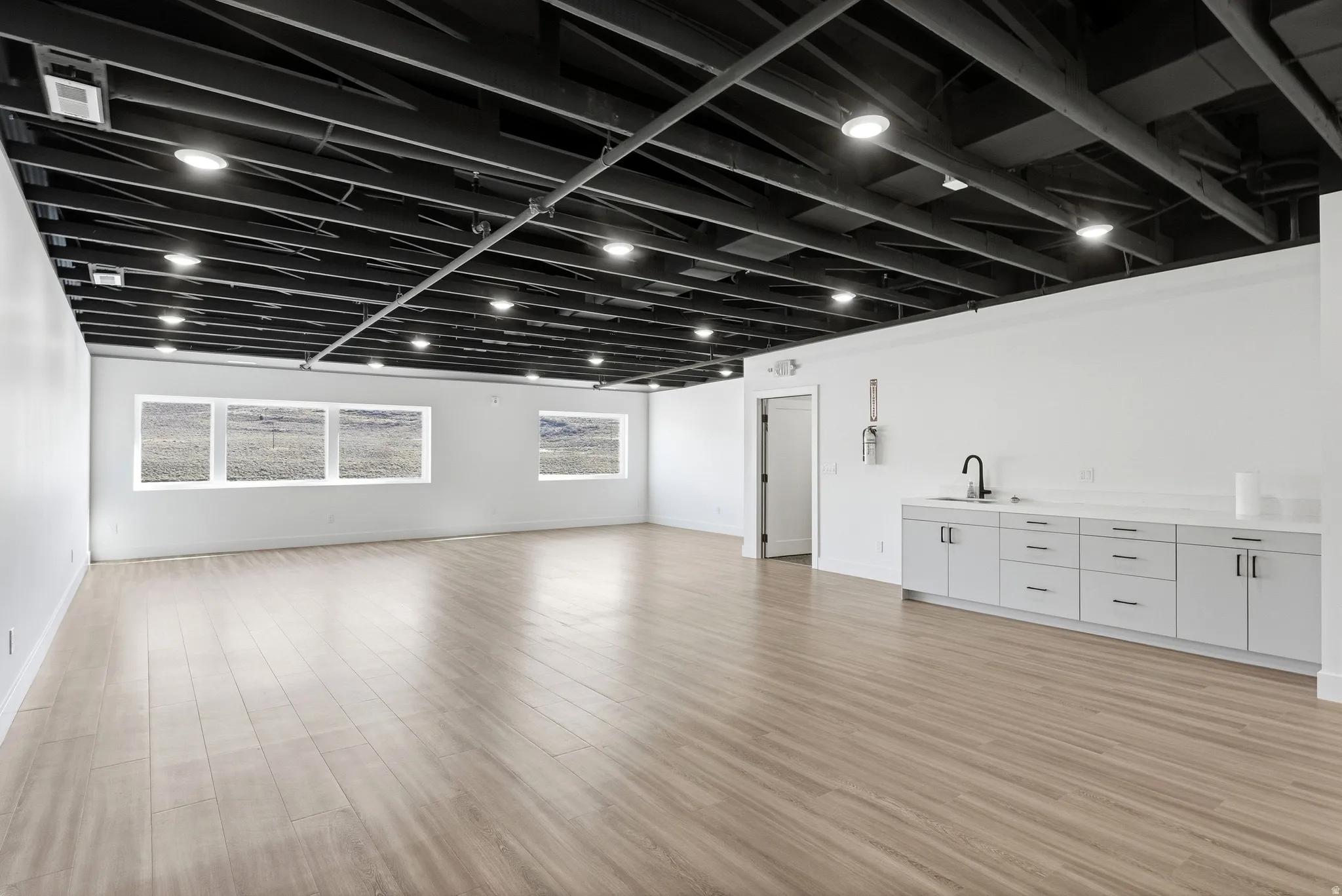 Miscellaneous room with light wood finished floors and baseboards