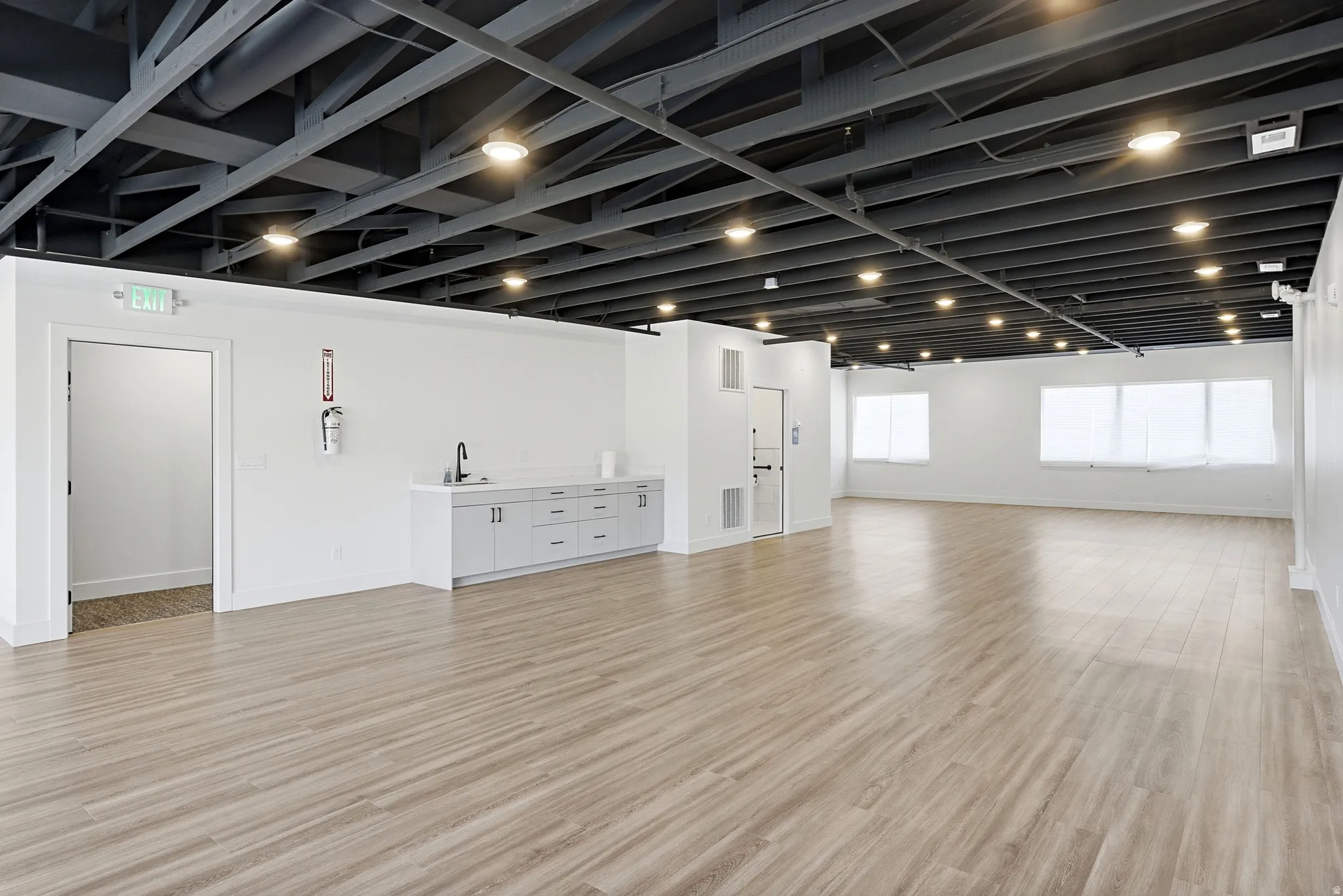 Below grade area featuring light wood finished floors