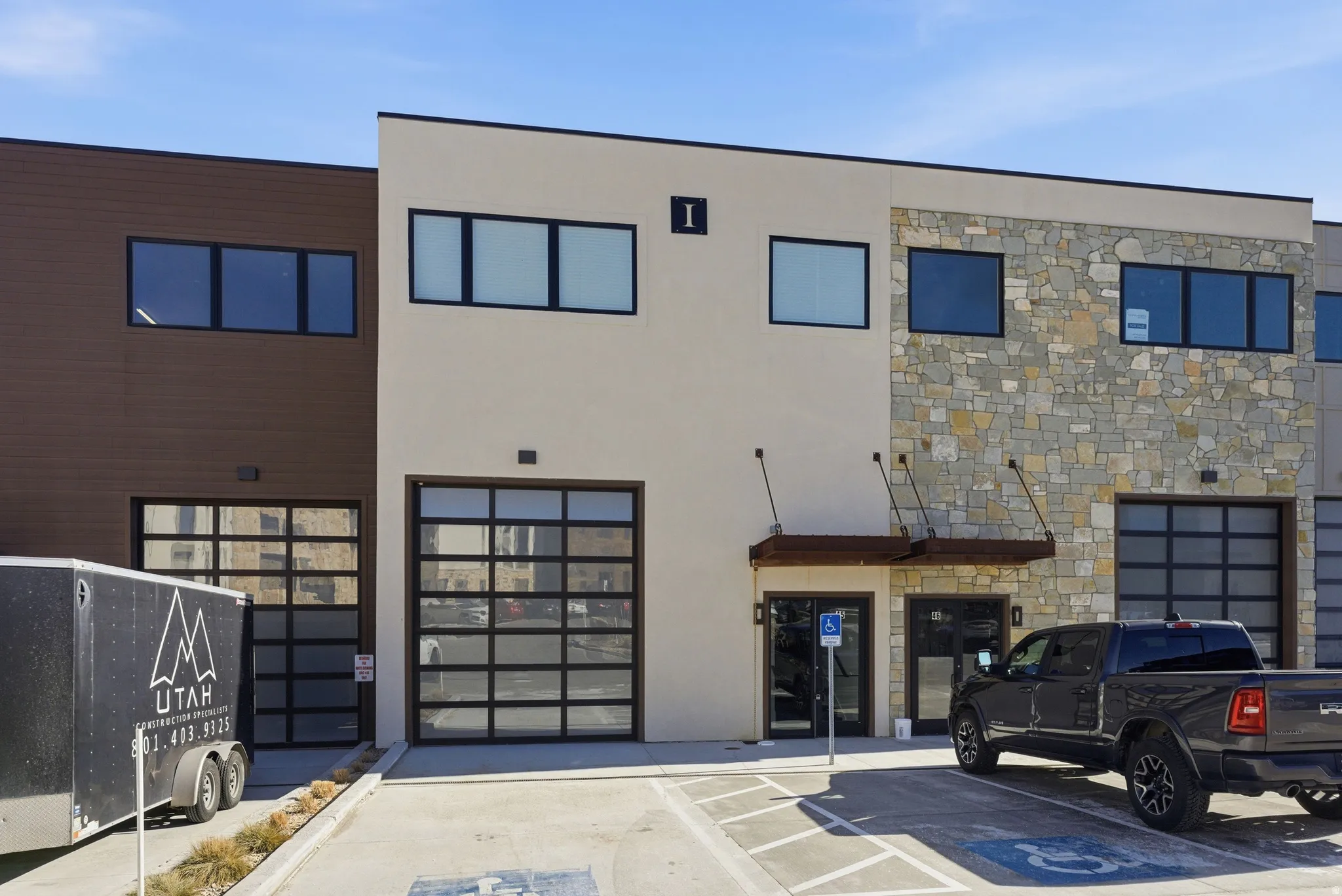 View of property with uncovered parking