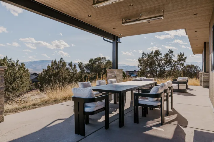 Expansive concrete patio with a covered outdoor area