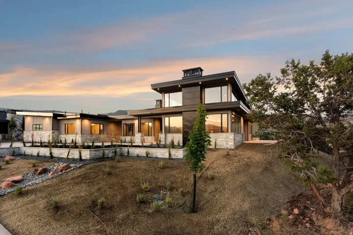 Modern architectural design with a dark facade and extensive glazing