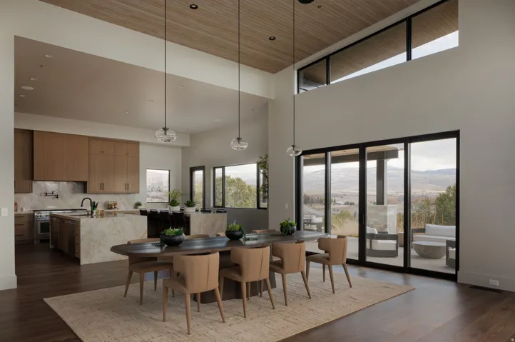 Open-concept living space with high ceilings and wood-finish flooring