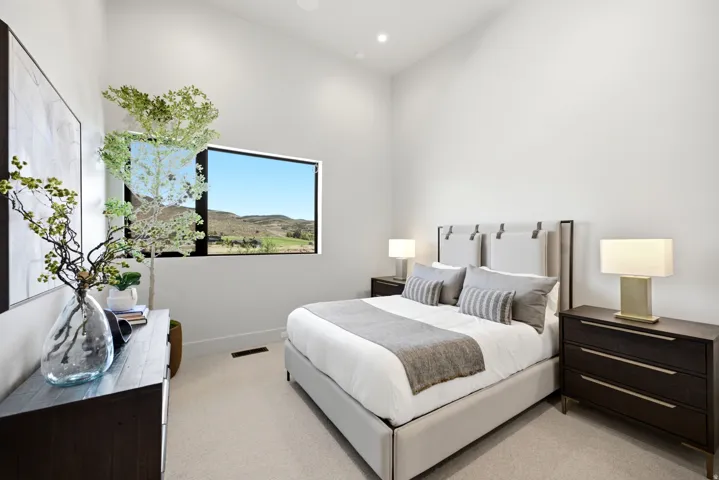 Vaulted ceiling, recessed lighting, carpeted flooring, built-in window, and dark wood-finish dresser