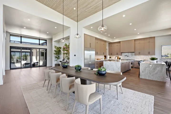 Open-concept living space featuring wood-finish flooring, a wood-paneled ceiling, and recessed lighting