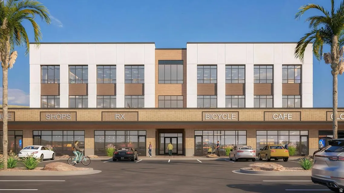 View of property featuring uncovered parking