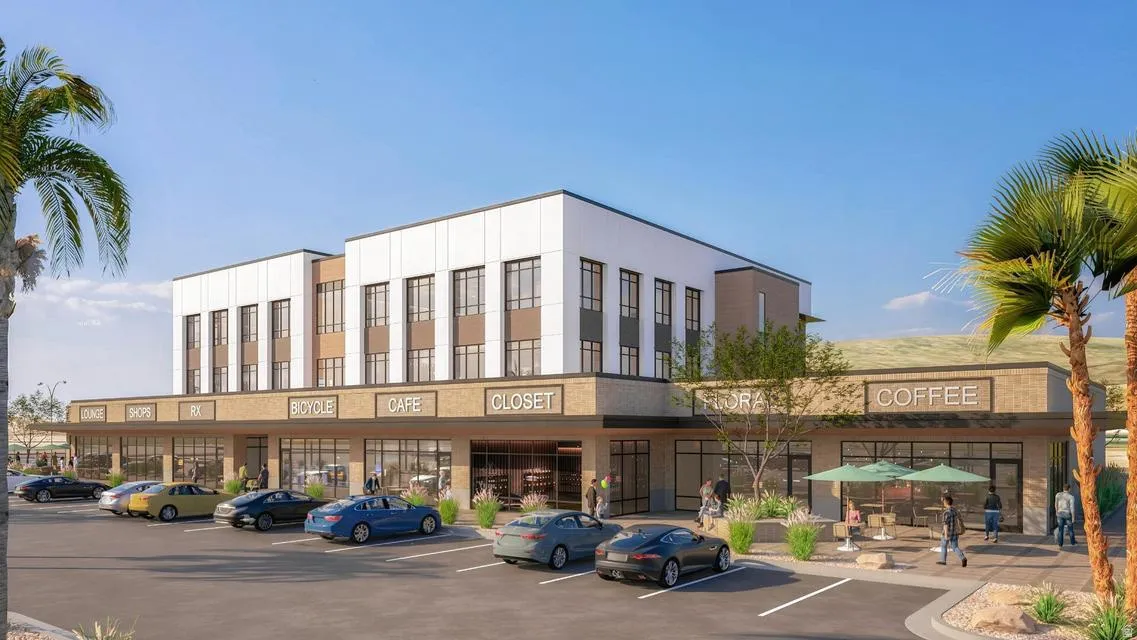 View of commercial property with uncovered parking